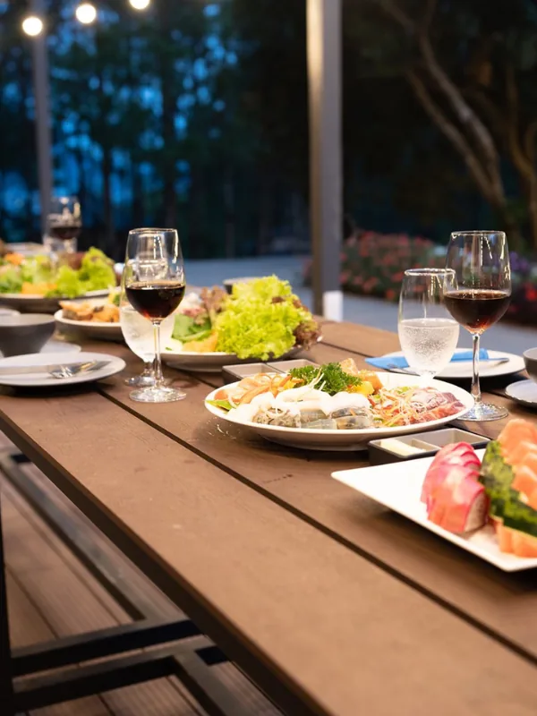 Alfresco dining banquet in the Voi Mountain pine forest at sunset