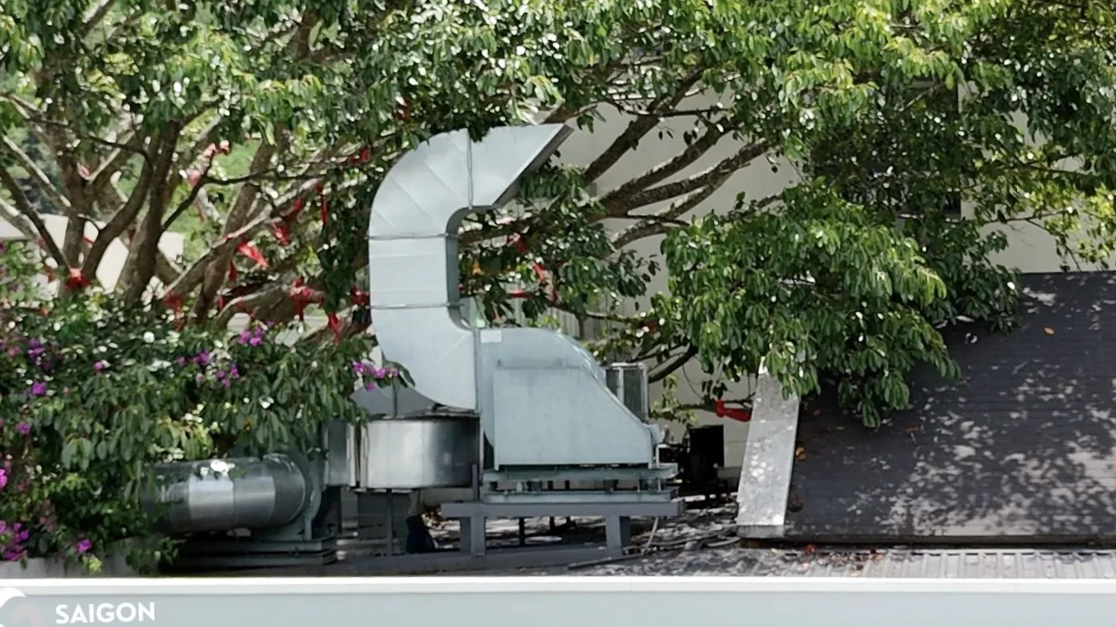 Rooftop industrial exhaust ductwork and heavy-duty ventilation fan assemblies